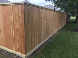 A Quality Fence & Outdoor Western Red Cedar Privacy Fence with a Top Cap